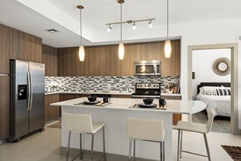 Gourmet kitchens with mosaic backsplash